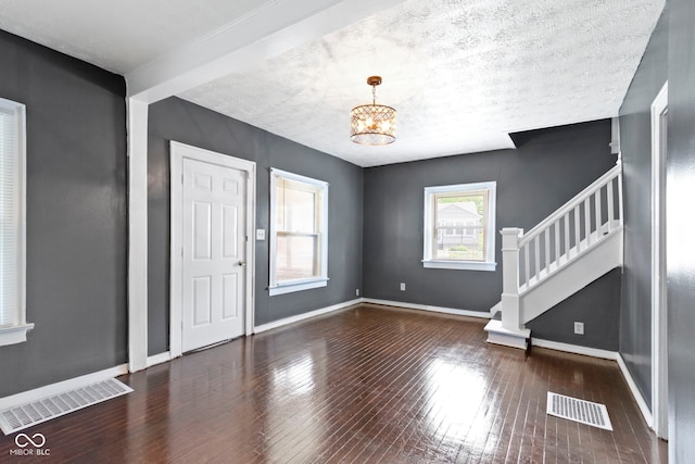 1021 W 37th St, Indianapolis, IN 46208 - entrance foyer featuring stairs, a chandelier, hardwood / wood-style flooring, and baseboards