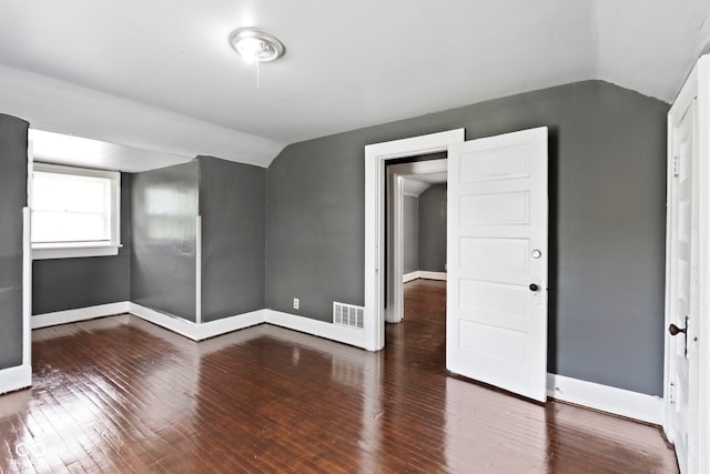 1021 W 37th St, Indianapolis, IN 46208 - unfurnished room featuring lofted ceiling, wood-type flooring, and baseboards