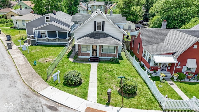 1021 W 37th St, Indianapolis, IN 46208 - view of front of property with brick siding and a shingled roof