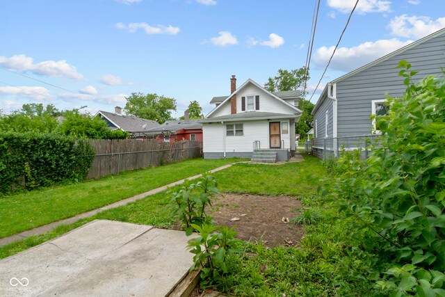 1021 W 37th St, Indianapolis, IN 46208 - rear view of house with a patio