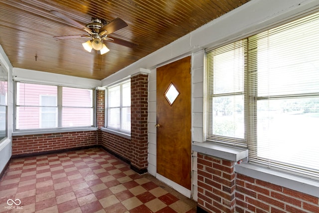 1021 W 37th St, Indianapolis, IN 46208 - unfurnished sunroom with tile patterned floors, brick wall, healthy amount of natural light, ceiling fan, and wood ceiling