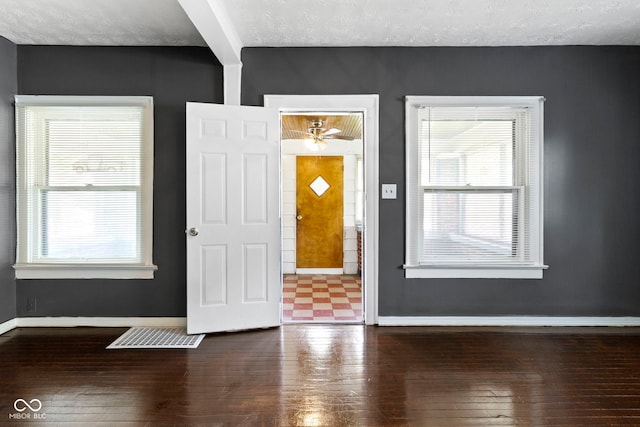 1021 W 37th St, Indianapolis, IN 46208 - foyer entrance featuring hardwood / wood-style flooring, baseboards, and a textured ceiling