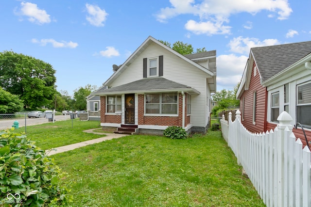 1021 W 37th St, Indianapolis, IN 46208 - view of front of property featuring brick siding and roof with shingles