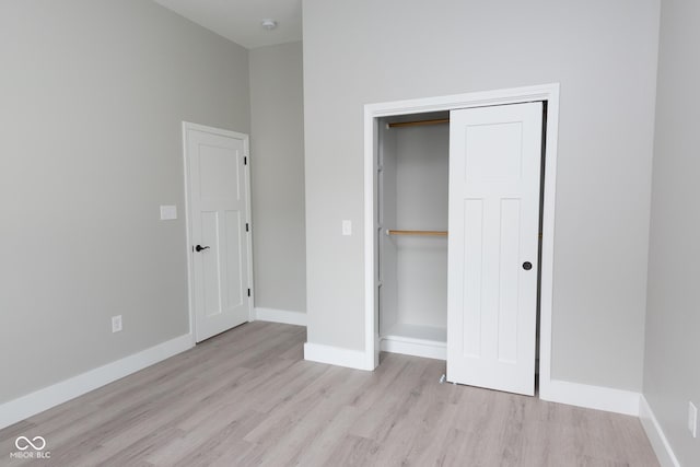 4625 W Naomi St, Indianapolis, IN 46241 - unfurnished bedroom with wood finished floors, baseboards, and a closet