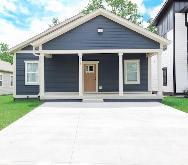 4625 W Naomi St, Indianapolis, IN 46241 - shotgun-style home with a porch