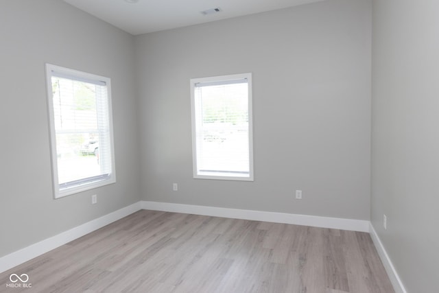 4625 W Naomi St, Indianapolis, IN 46241 - spare room featuring light wood-style floors and baseboards