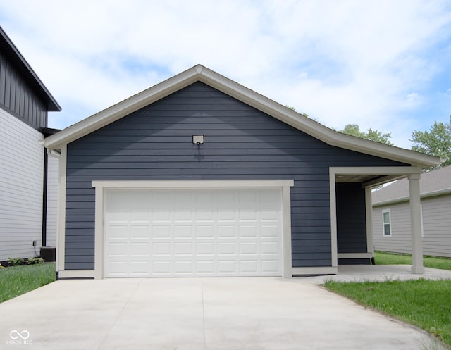4625 W Naomi St, Indianapolis, IN 46241 - view of front of home featuring a garage, driveway, and an outdoor structure