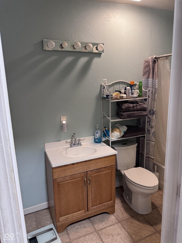 2208 S F St, Elwood, IN 46036 - bathroom with toilet, a shower with shower curtain, vanity, and baseboards