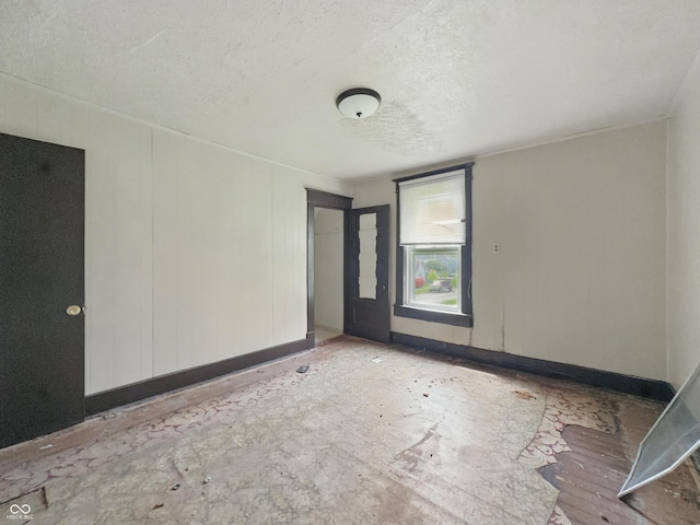 526 N Centennial St, Indianapolis, IN 46222 - unfurnished room featuring a textured ceiling and baseboards