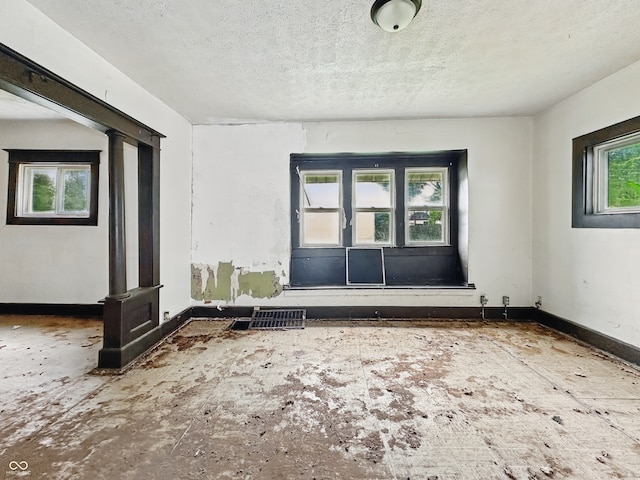 526 N Centennial St, Indianapolis, IN 46222 - spare room featuring a textured ceiling and baseboards