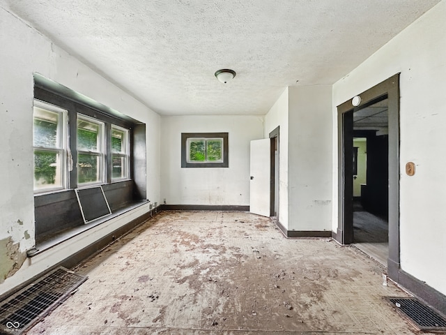 526 N Centennial St, Indianapolis, IN 46222 - empty room with a textured ceiling and baseboards