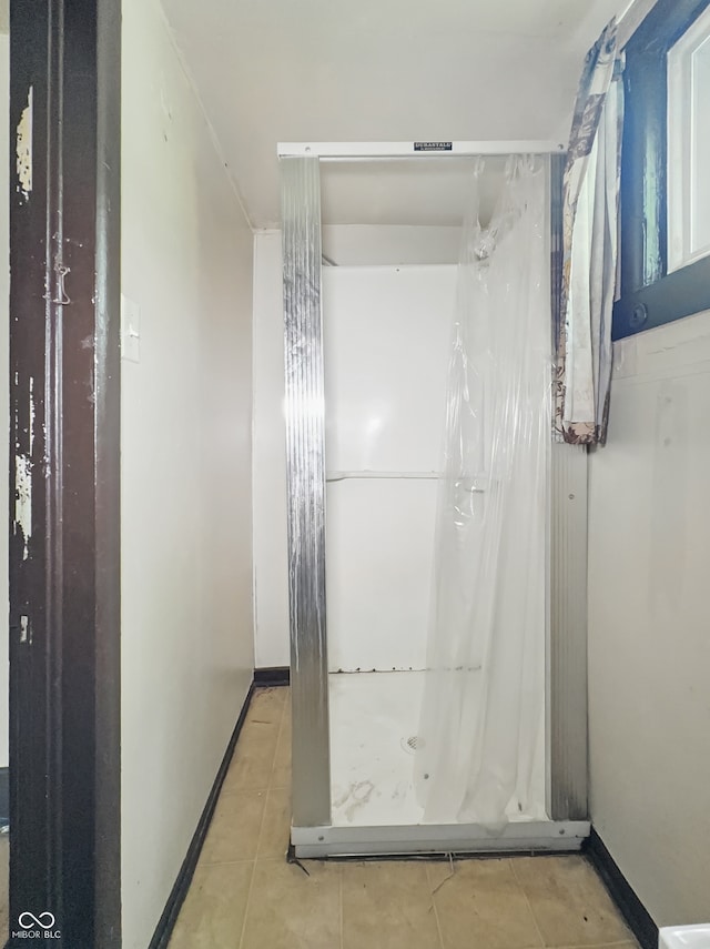 526 N Centennial St, Indianapolis, IN 46222 - full bathroom with tile patterned flooring, a stall shower, and baseboards