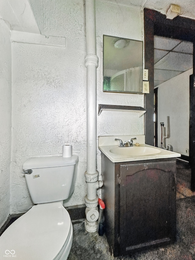 526 N Centennial St, Indianapolis, IN 46222 - bathroom featuring toilet, vanity, and a textured wall