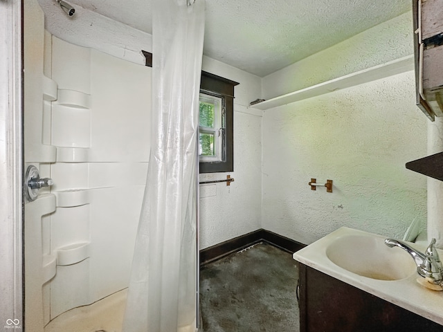 526 N Centennial St, Indianapolis, IN 46222 - full bath with a textured wall, curtained shower, vanity, baseboards, and a textured ceiling