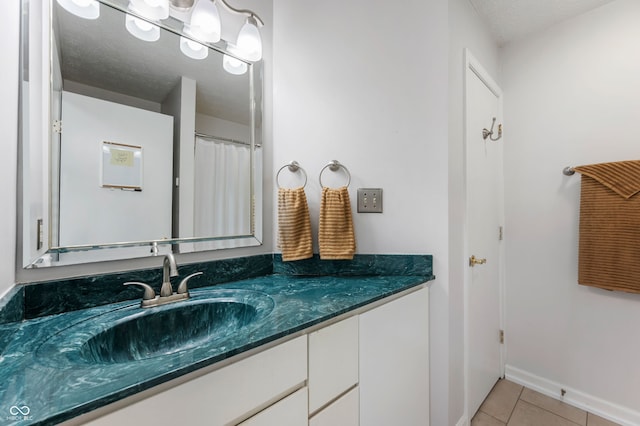 6263 Behner Way, Indianapolis, IN 46250 - full bathroom featuring vanity, tile patterned floors, and baseboards