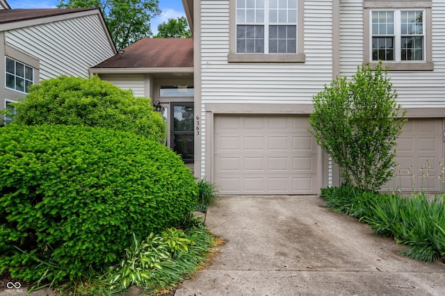 6263 Behner Way, Indianapolis, IN 46250 - view of front of house featuring an attached garage and concrete driveway