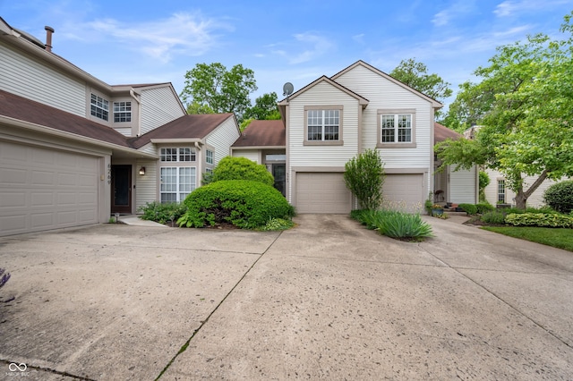 6263 Behner Way, Indianapolis, IN 46250 - traditional home featuring concrete driveway and a garage