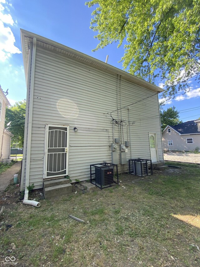 653 Birch Ave, Indianapolis, IN 46221 - back of house with entry steps and central air condition unit