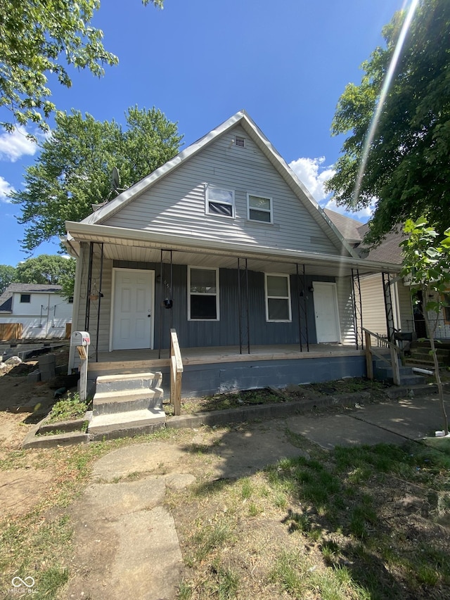 653 Birch Ave, Indianapolis, IN 46221 - bungalow featuring covered porch and board and batten siding