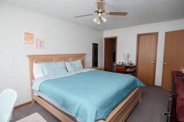 540 Cahill Ln, Indianapolis, IN 46214 - bedroom featuring carpet flooring, a textured ceiling, multiple closets, and ceiling fan