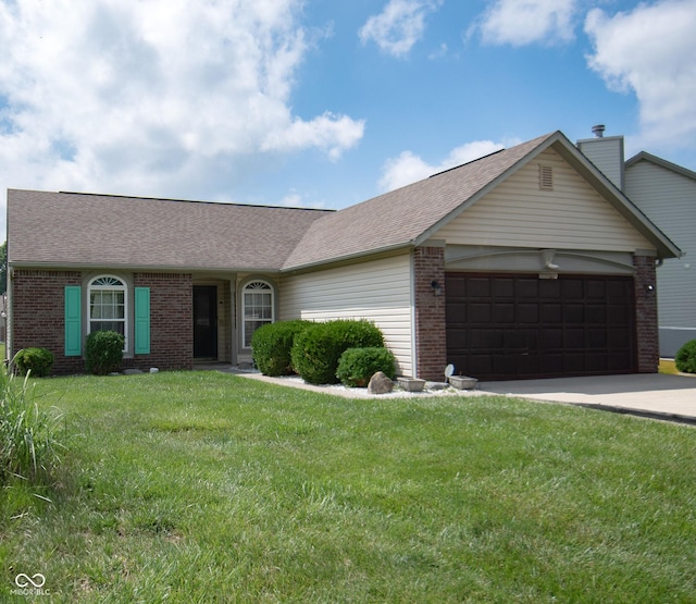 540 Cahill Ln, Indianapolis, IN 46214 - single story home with brick siding, an attached garage, a front yard, driveway, and roof with shingles