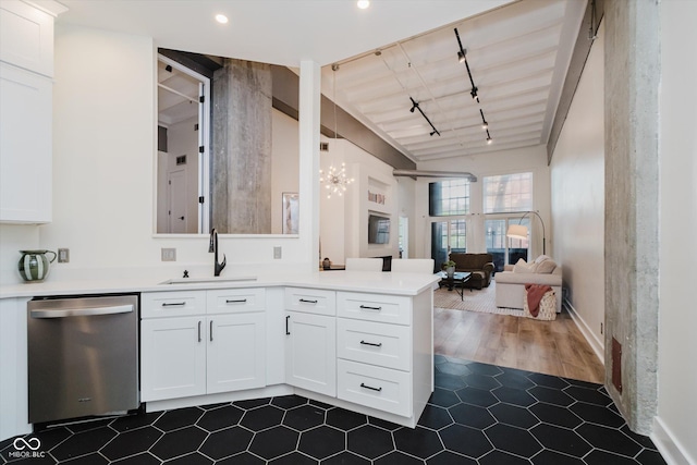 611 N Park Ave Unit 108, Indianapolis, IN 46204 - kitchen featuring dishwasher, a sink, a chandelier, open floor plan, and a peninsula