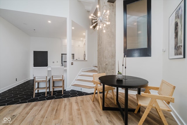 611 N Park Ave Unit 108, Indianapolis, IN 46204 - dining area featuring dark wood-style flooring, a chandelier, recessed lighting, and baseboards
