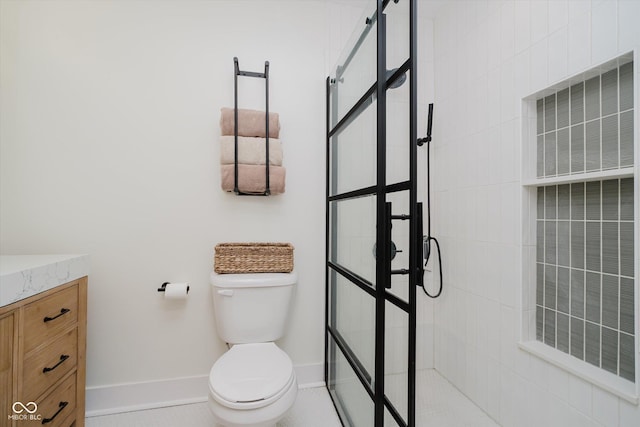 611 N Park Ave Unit 108, Indianapolis, IN 46204 - full bath featuring toilet, a walk in shower, vanity, and baseboards