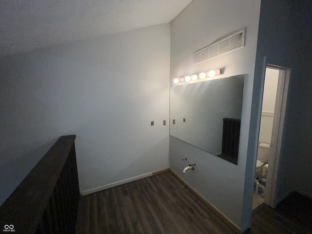 5711 Bradston Way, Indianapolis, IN 46237 - bathroom featuring wood finished floors, toilet, and baseboards