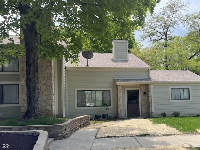 5711 Bradston Way, Indianapolis, IN 46237 - view of front of property featuring stone siding, a shingled roof, and a chimney