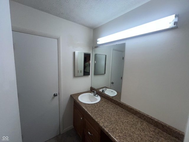 5711 Bradston Way, Indianapolis, IN 46237 - bathroom with vanity and a textured ceiling