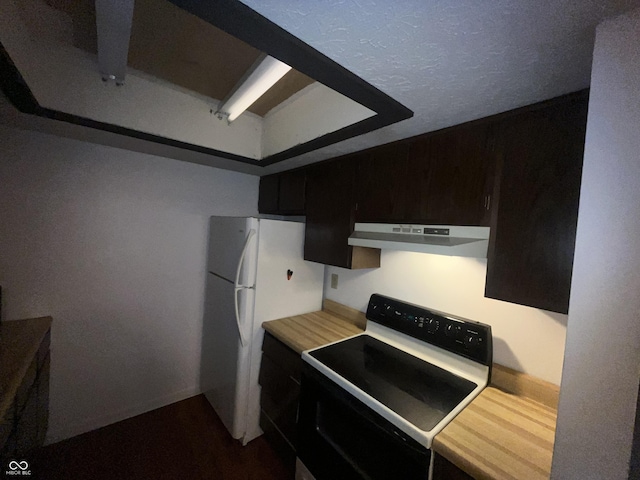 5711 Bradston Way, Indianapolis, IN 46237 - kitchen featuring electric range, under cabinet range hood, light countertops, freestanding refrigerator, and dark cabinetry
