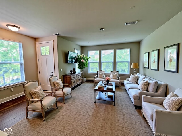 17399 Dovehouse Ln, Westfield, IN 46074 - living room with healthy amount of natural light, hardwood / wood-style floors, and baseboards