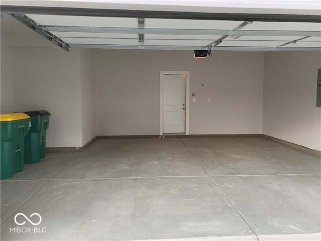 17399 Dovehouse Ln, Westfield, IN 46074 - garage with a garage door opener, baseboards, and electric panel