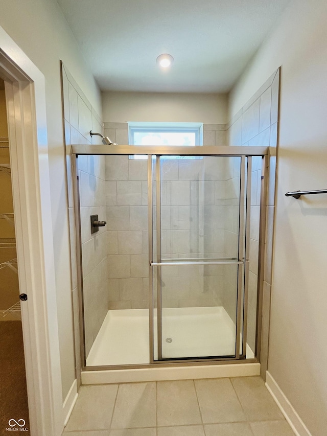 17399 Dovehouse Ln, Westfield, IN 46074 - full bathroom featuring tile patterned floors, a shower stall, and baseboards