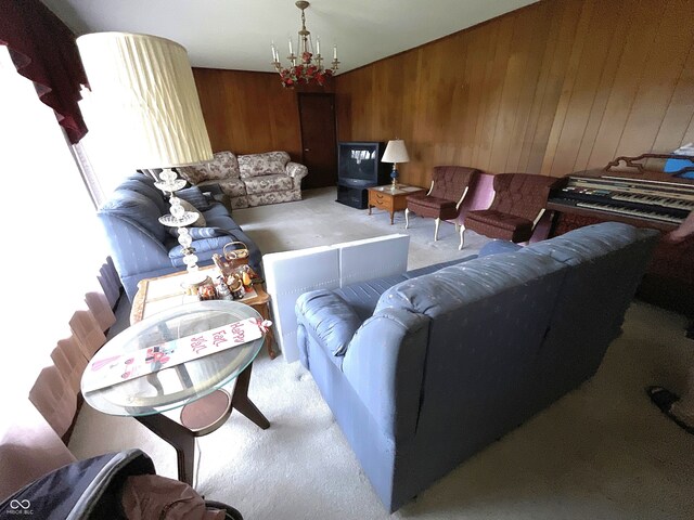 851 E Franklin St, Spencer, IN 47460 - carpeted living area with wood walls and a chandelier
