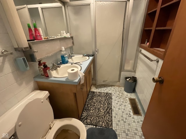 851 E Franklin St, Spencer, IN 47460 - full bath with a stall shower, double vanity, and tile patterned floors