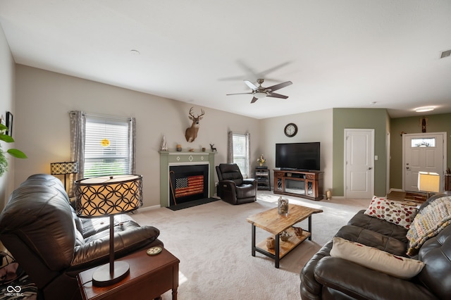 5576 W Glenview Dr, Mccordsville, IN 46055 - living room featuring ceiling fan, light colored carpet, a fireplace with flush hearth, and baseboards