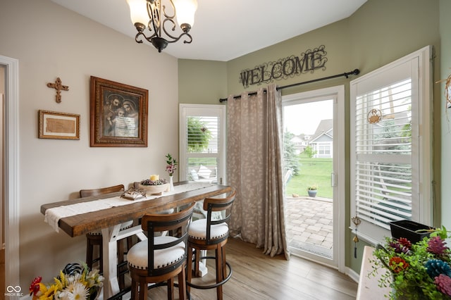 5576 W Glenview Dr, Mccordsville, IN 46055 - dining area with a chandelier and light wood-type flooring