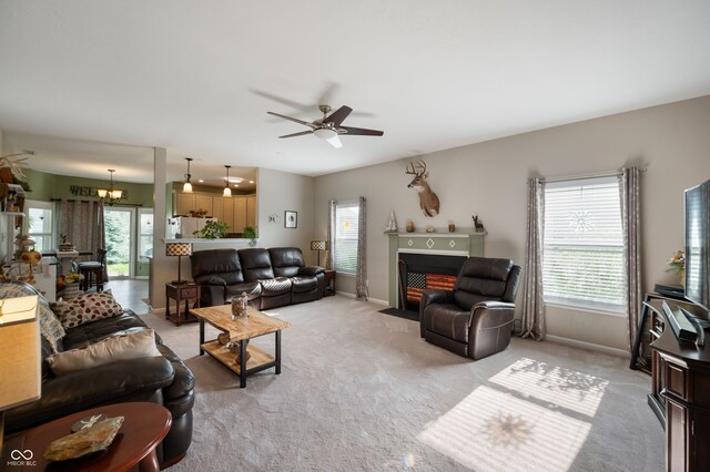5576 W Glenview Dr, Mccordsville, IN 46055 - living area with plenty of natural light, a ceiling fan, and light colored carpet