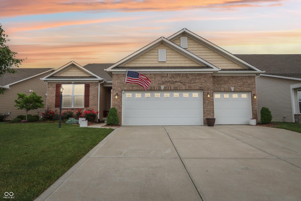 1468 Blackthorne Trl N, Plainfield, IN 46168 - traditional-style home with driveway, a yard, an attached garage, and brick siding