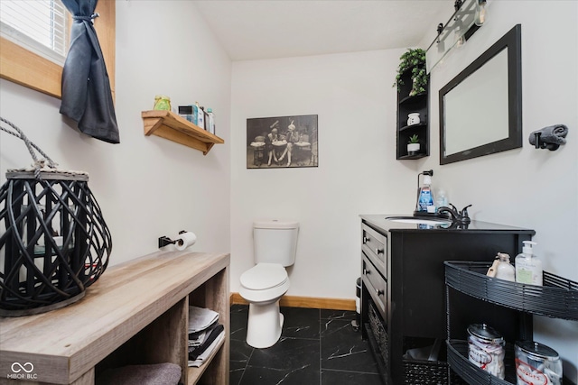 1254 N State Road 39, Frankfort, IN 46041 - bathroom featuring vanity, toilet, and baseboards