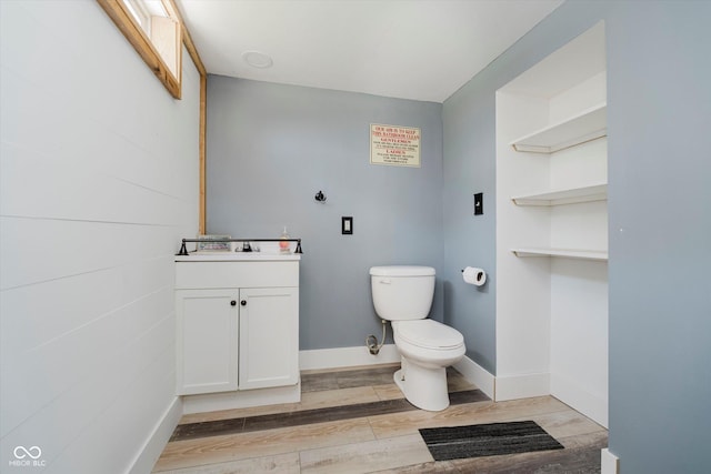 1254 N State Road 39, Frankfort, IN 46041 - half bathroom with vanity, toilet, wood finished floors, and baseboards