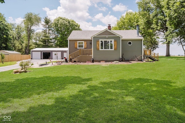 1254 N State Road 39, Frankfort, IN 46041 - view of front of home with a detached garage, a chimney, an outbuilding, and a shingled roof