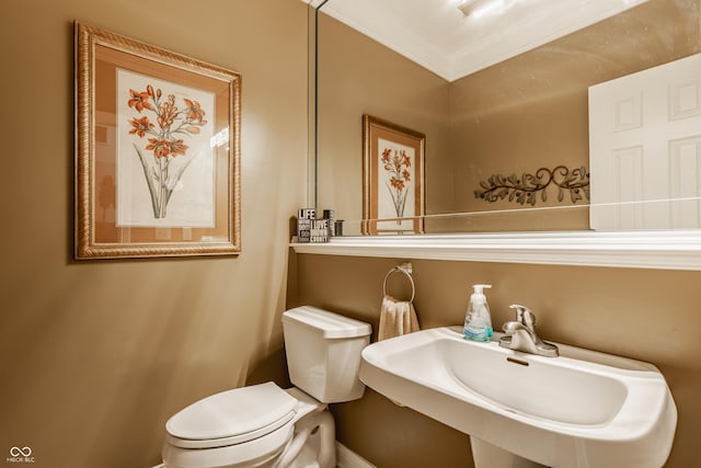 12539 Pebblepointe Pass, Carmel, IN 46033 - half bathroom featuring toilet, a sink, baseboards, and ornamental molding