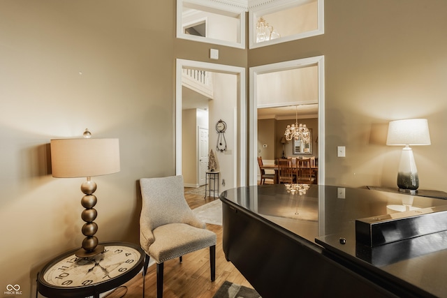 12539 Pebblepointe Pass, Carmel, IN 46033 - office featuring light wood-style floors, a chandelier, a high ceiling, and baseboards