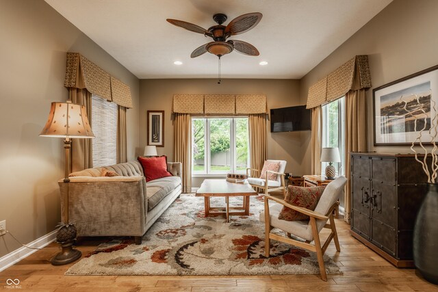 12539 Pebblepointe Pass, Carmel, IN 46033 - living room with healthy amount of natural light, a ceiling fan, hardwood / wood-style flooring, recessed lighting, and baseboards
