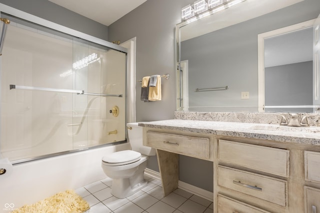 12539 Pebblepointe Pass, Carmel, IN 46033 - full bathroom with toilet, vanity, tile patterned flooring, and bath / shower combo with glass door