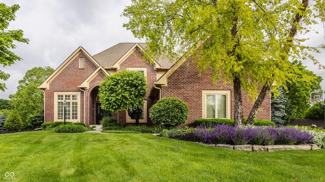 12539 Pebblepointe Pass, Carmel, IN 46033 - view of front facade with brick siding and a front lawn
