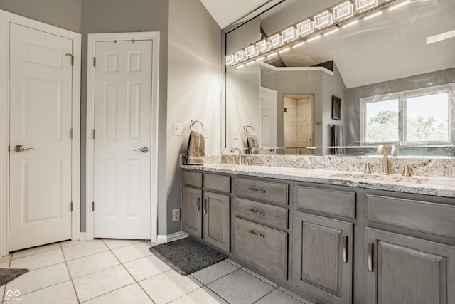 12539 Pebblepointe Pass, Carmel, IN 46033 - full bath with double vanity, tile patterned floors, a tile shower, and baseboards